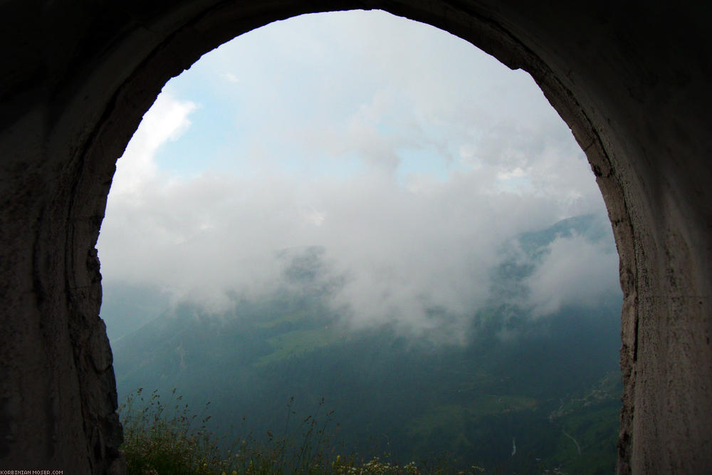 ﻿Clouds and mountains in the tunnel window.