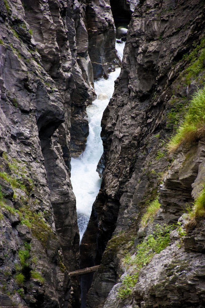 ﻿Below roars the water.