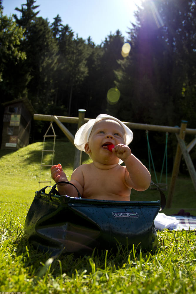 ﻿The daily bath today takes place in the midday sun, while it is still warm.